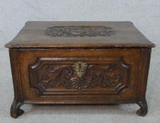 A late 18th/early 19th century carved oak twin handled rectangular box, possible bible box, raised
