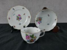 A 20th century Herend cup, saucer and cake plate, decorated with sprays of flowers. H.1 W.17 D.