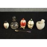 Two 20th century gilt and enamel egg ornaments, together with a small glass globular scent bottle