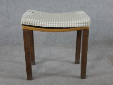 An Art Deco limed oak George VI Coronation stool, with inverted upholstered seat raised on square