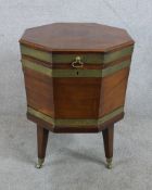 A George III mahogany and brass mounted octagonal wine cooler, raised on tapering supports