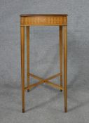 An Edwardian style Baker Furniture inlaid satinwood square topped lamp table raised on tapering