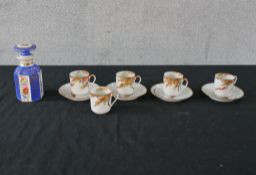 A set of four Chinese porcelain cups and saucers, decorated with autumn leaves, (with additional