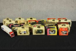 Assortment of boxed Lledo and Matchbox scale model vans. Collection of toy cars. H.7 W.25 D.5cm. (