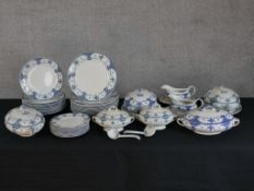 An early 20th century F. Winkle 'Carlton' part blue and white part dinner set, comprising of plates,