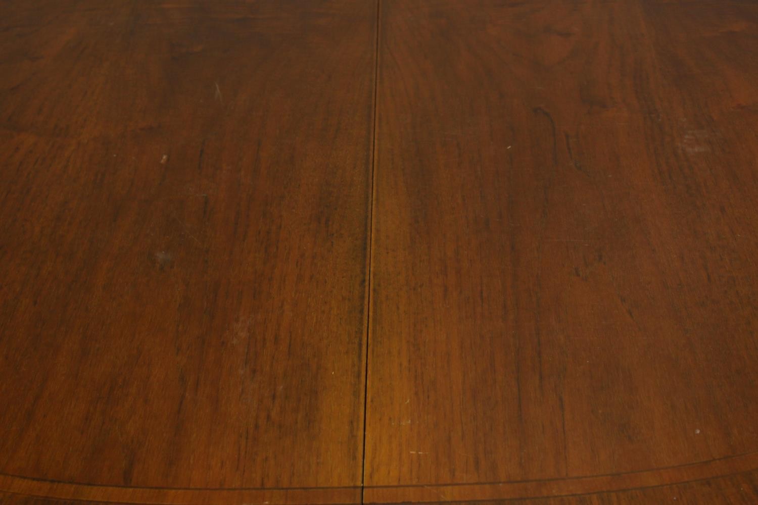 A 20th century mahogany pull oval extendable table, on four carved trumpeting supports terminating - Image 3 of 10