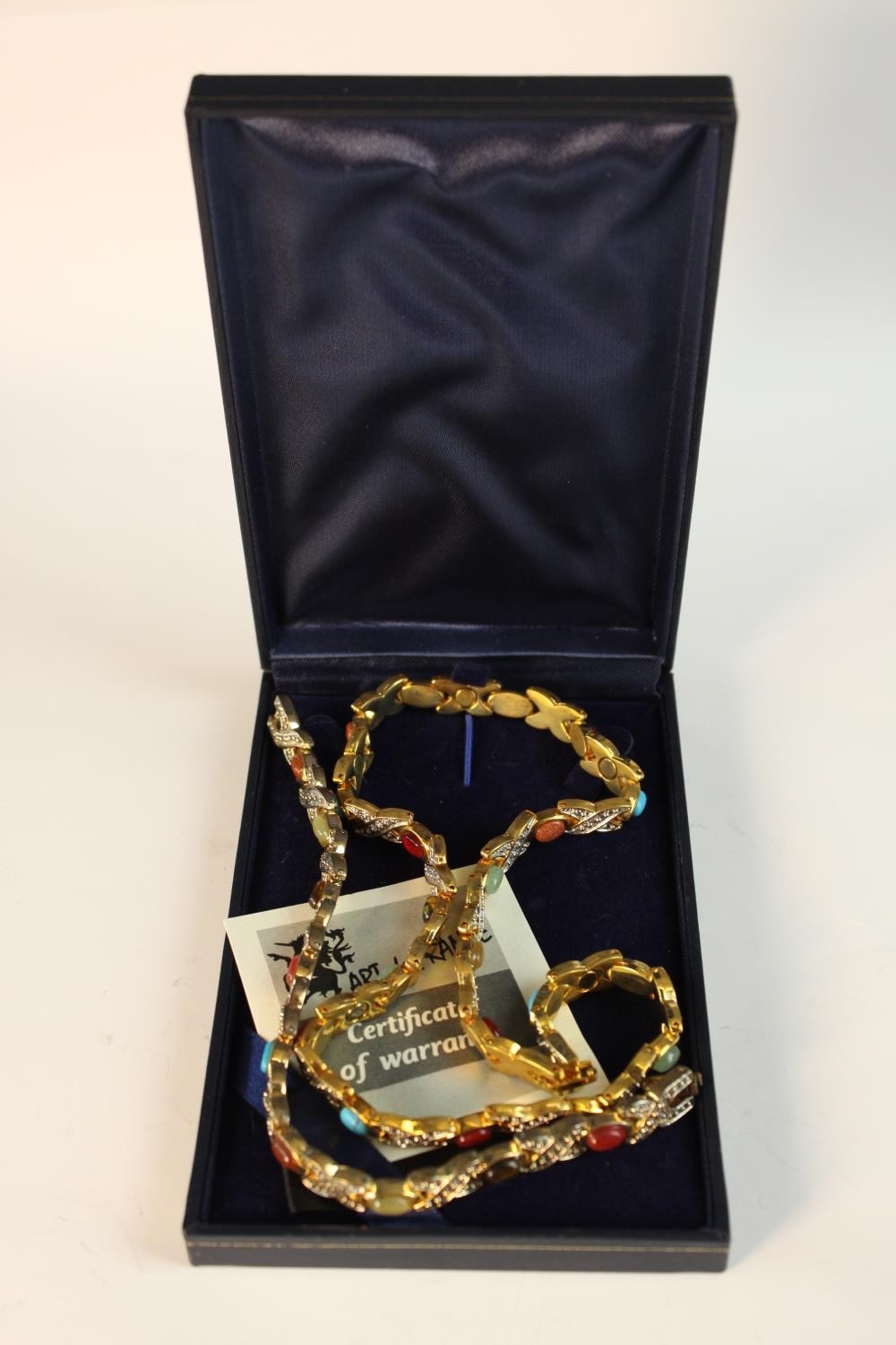 An Art de France gem set magnet circulation bracelet and necklace with certificate. L.14 W.9cm.(box)