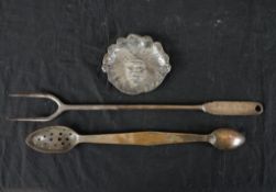 A 19th century silver plated double spoon, a silver plated toasting fork and a brass tray cast in