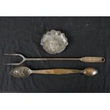 A 19th century silver plated double spoon, a silver plated toasting fork and a brass tray cast in