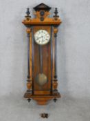 A 19th century mahogany cased Vienna style wall clock, the dial with black Roman numerals and