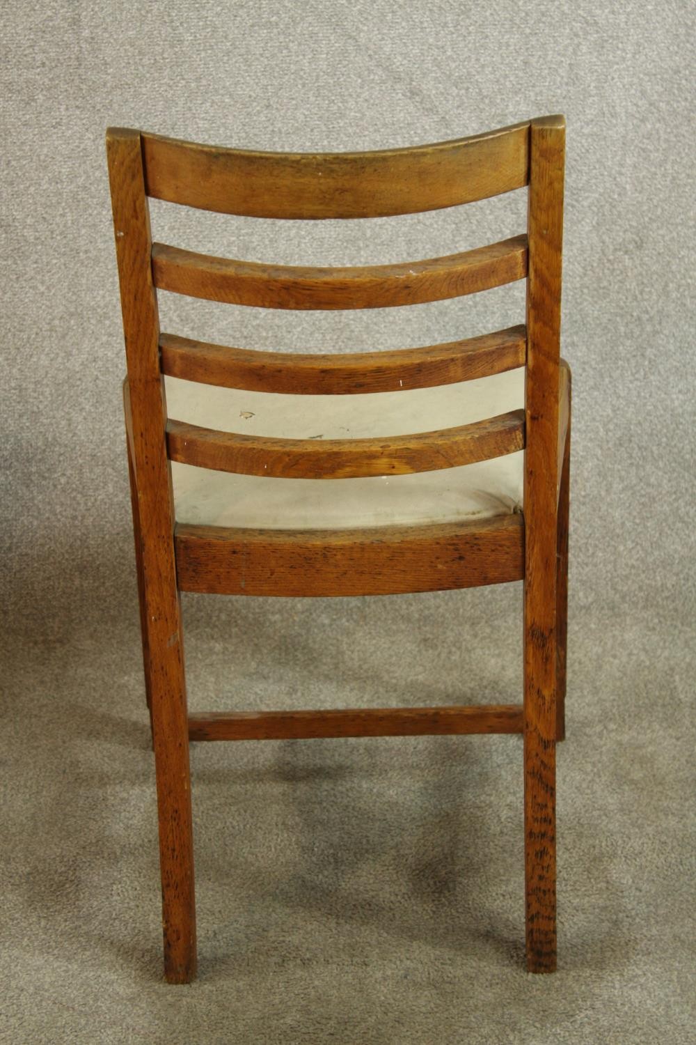 A pair of early 20th century oak framed ladder back chairs, raised on carved supports with drop in - Image 6 of 8