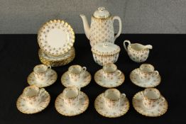 A 20th century Spode Fleur de Lys coffee set comprised of eight cups, saucers, cake plates, milk