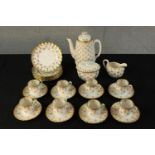 A 20th century Spode Fleur de Lys coffee set comprised of eight cups, saucers, cake plates, milk