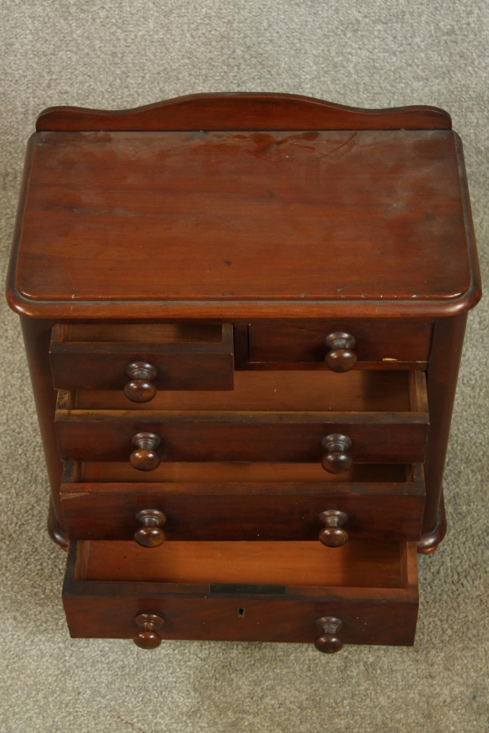 A 19th century mahogany apprentices chest of two short over three graduating drawers with turned - Image 3 of 5