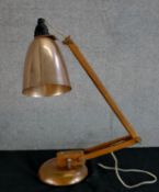 A mid 20th century copper effect angle poise lamp. H.42 W.40 D.13cm