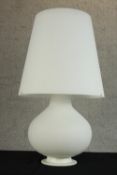 A contemporary white glass three light baluster shaped table lamp. H.80 Dia. 50cm.