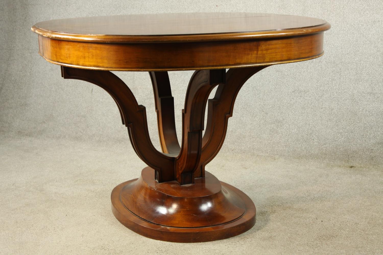 A 20th century mahogany pull oval extendable table, on four carved trumpeting supports terminating - Image 10 of 10