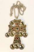 A boxed large statement Swedish silver gilt red and green paste stone set cross on silver chain.