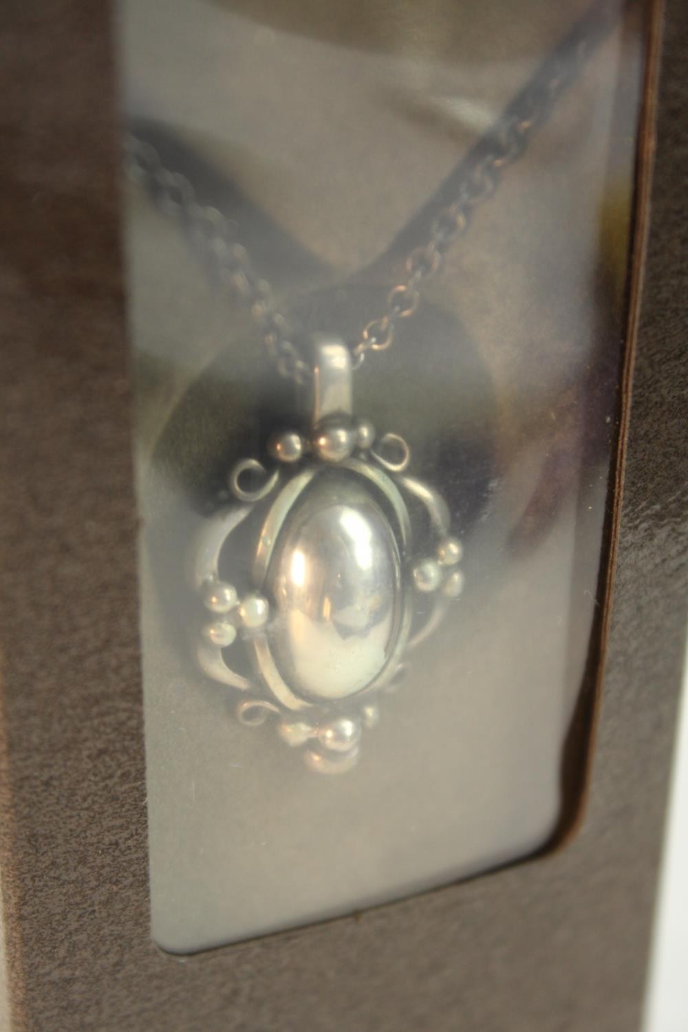 Georg Jensen- a boxed as new sterling silver 1989 Annual floral and foliate design pendant and - Image 5 of 6