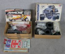 Two boxed scale model remote control cars including Tamiya 1:12 Midnight Pumpkin monster truck and