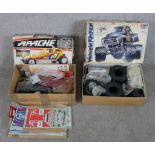 Two boxed scale model remote control cars including Tamiya 1:12 Midnight Pumpkin monster truck and