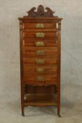 An Edwardian walnut seven drawer music/sheet music cabinet, each with brass swing handles and