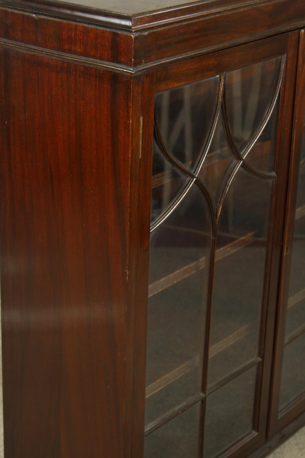 An early 20th century mahogany two door door display cabinet raised on shaped bracket feet. H.107 W. - Image 5 of 7
