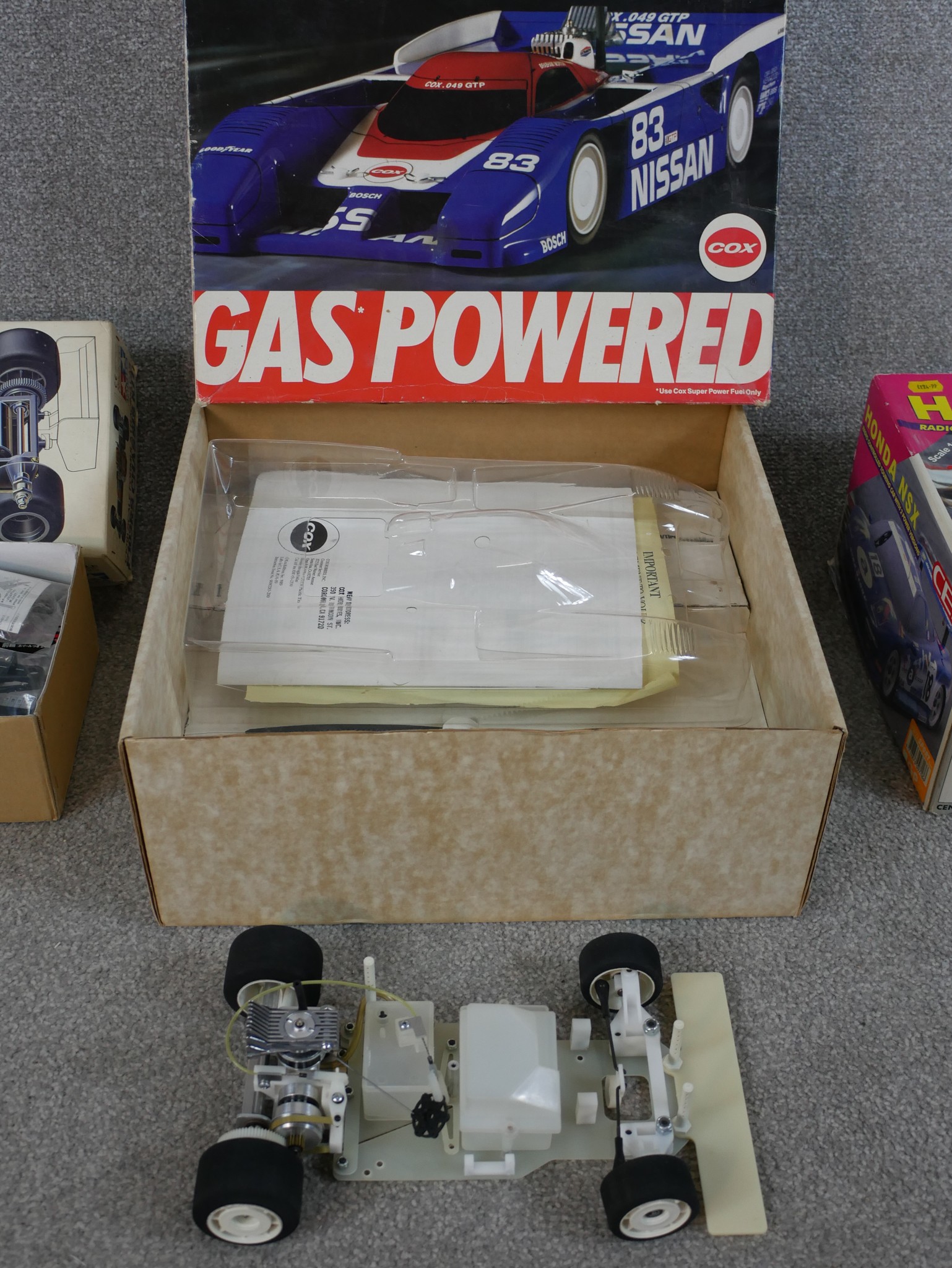 Three boxed scale model cars to include Tamiya 1:10 F103RS Chassis kit, Nissan 93 Cox racing car & - Image 5 of 7