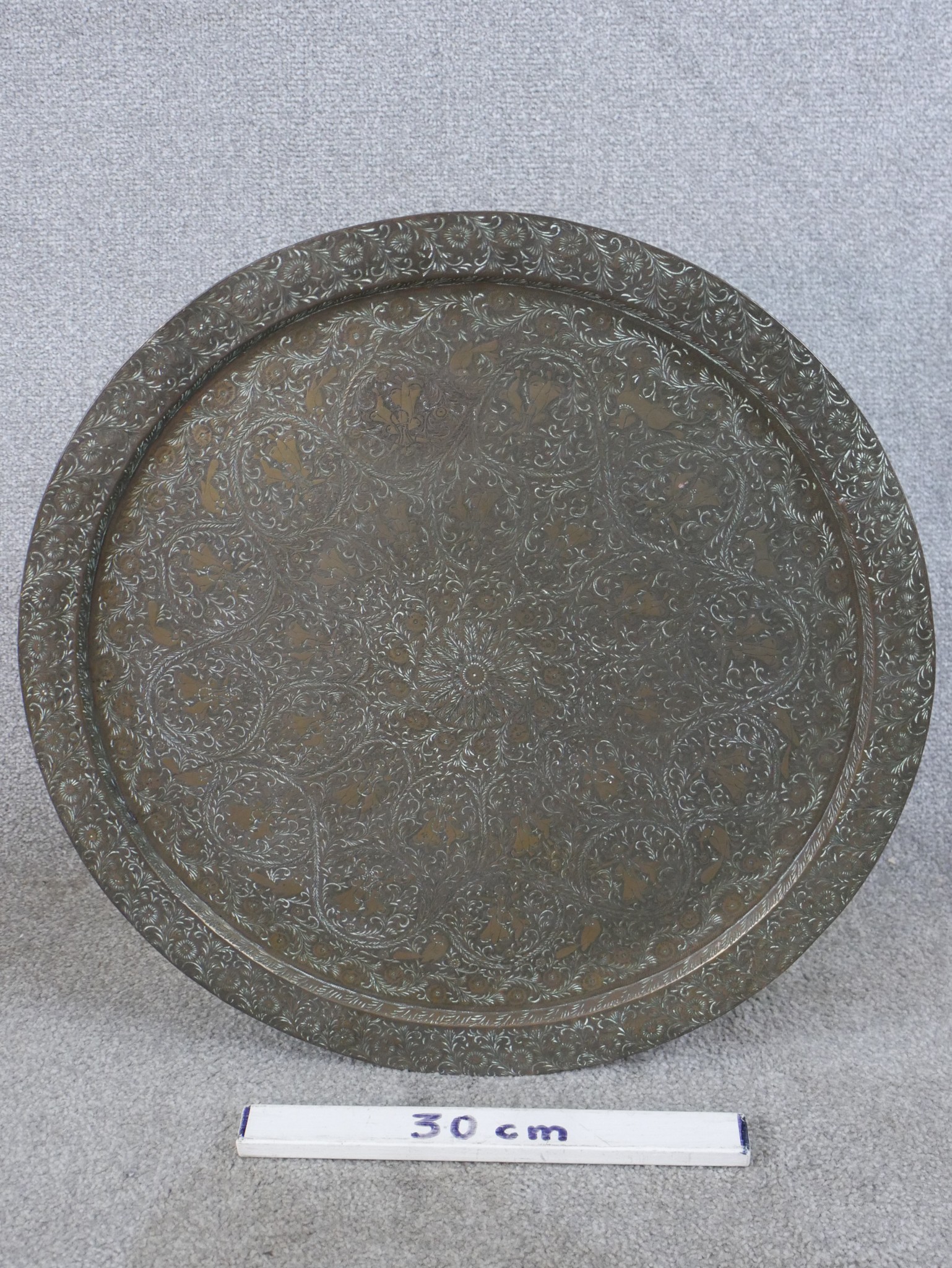 A 20th century engraved, possibly Moroccan circular brass charger with all over engraved decoration. - Image 3 of 4