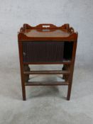 A George III mahogany tambour fronted tray top commode, raised on square tapering supports. H.77 W.