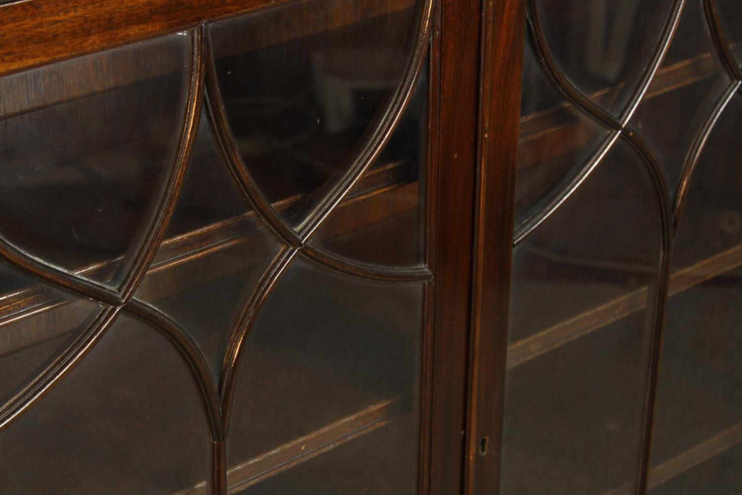 An early 20th century mahogany two door door display cabinet raised on shaped bracket feet. H.107 W. - Image 6 of 7