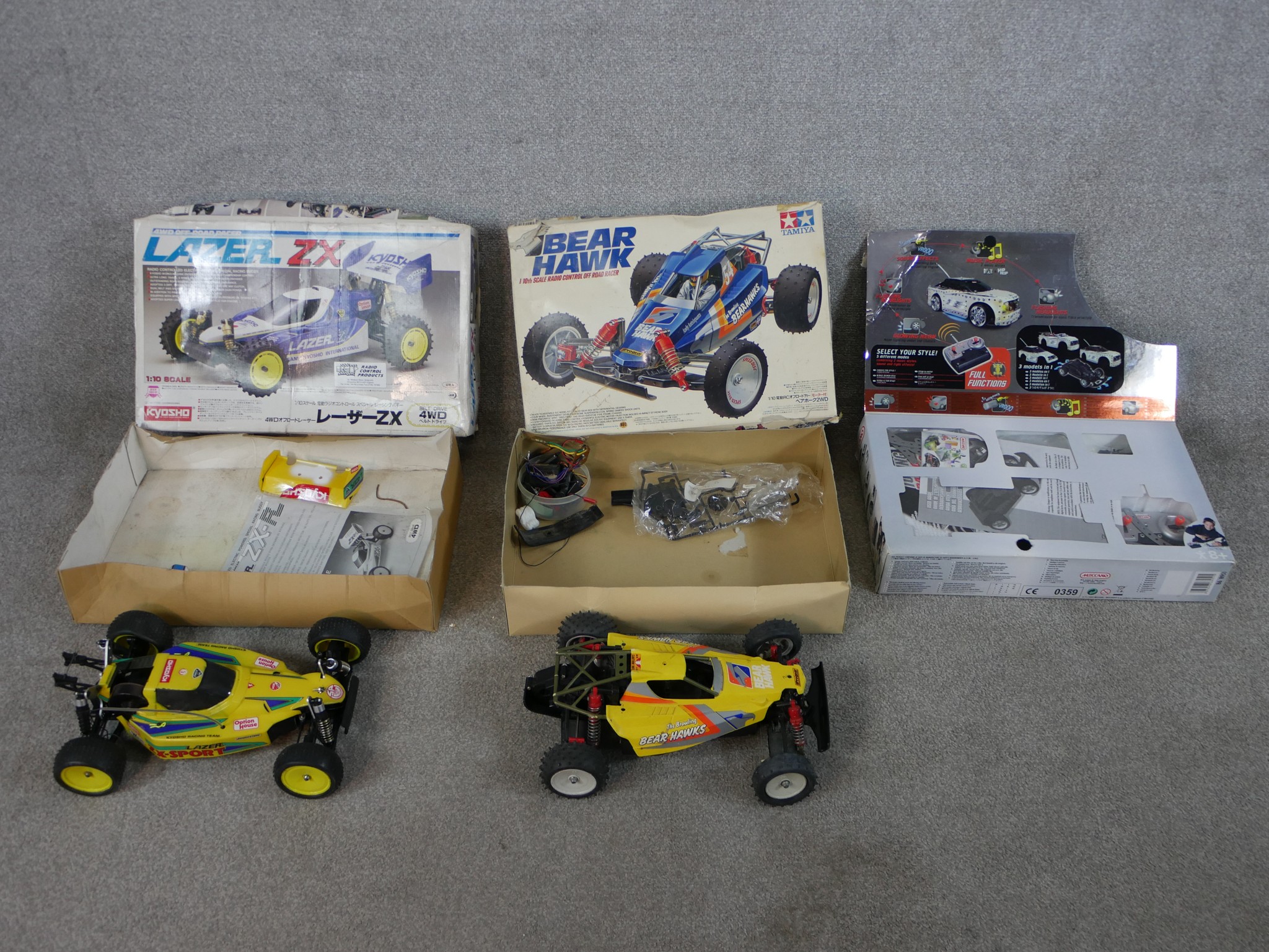 Three boxed scale model vehicles to include Kyosho 1:10 Lazer ZX remote control car, Tamiya 1:10