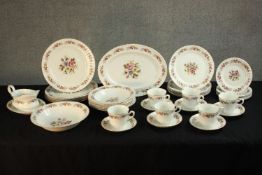 A 20th century Royal Stafford bone china part dinner and tea set painted with sprays of flowers. L.