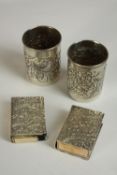 Two Egyptian silver matchbox covers, embossed with floral decoration together with two Egyptian