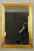 A contemporary rectangular gilt framed mirror. H.100 W.69cm.