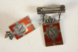 Two Georg Jensen silver and enamel commemorative badges, circa 1945 period in the form of a