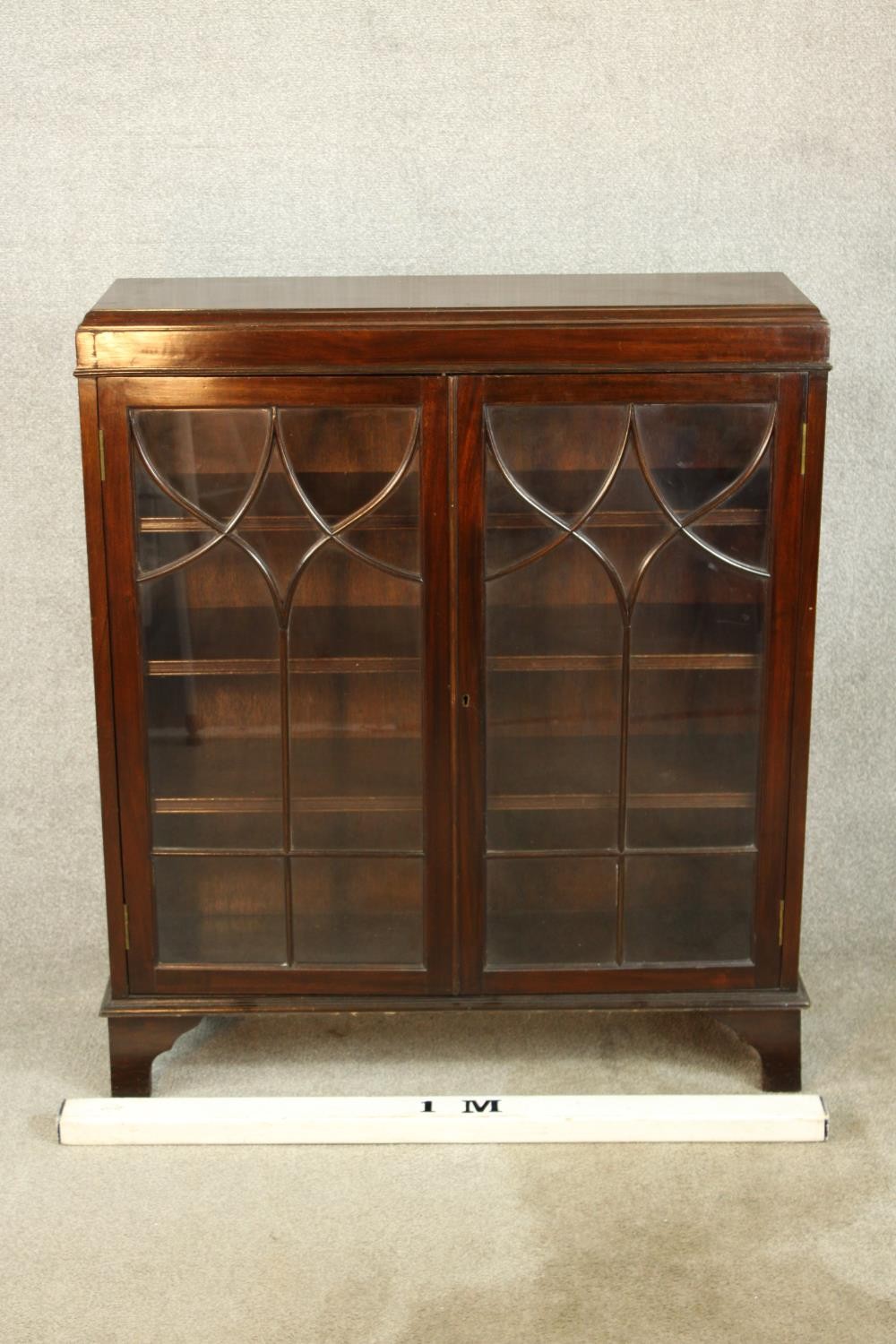 An early 20th century mahogany two door door display cabinet raised on shaped bracket feet. H.107 W. - Image 2 of 7