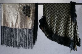 Two early 20th century embroidered shawls to include one with fur trim. H.80 W.130 largest