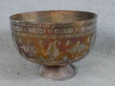 A 19th century Northern Iraqi copper wine bowl with incised decoration. H.30 W.41 D.41cm
