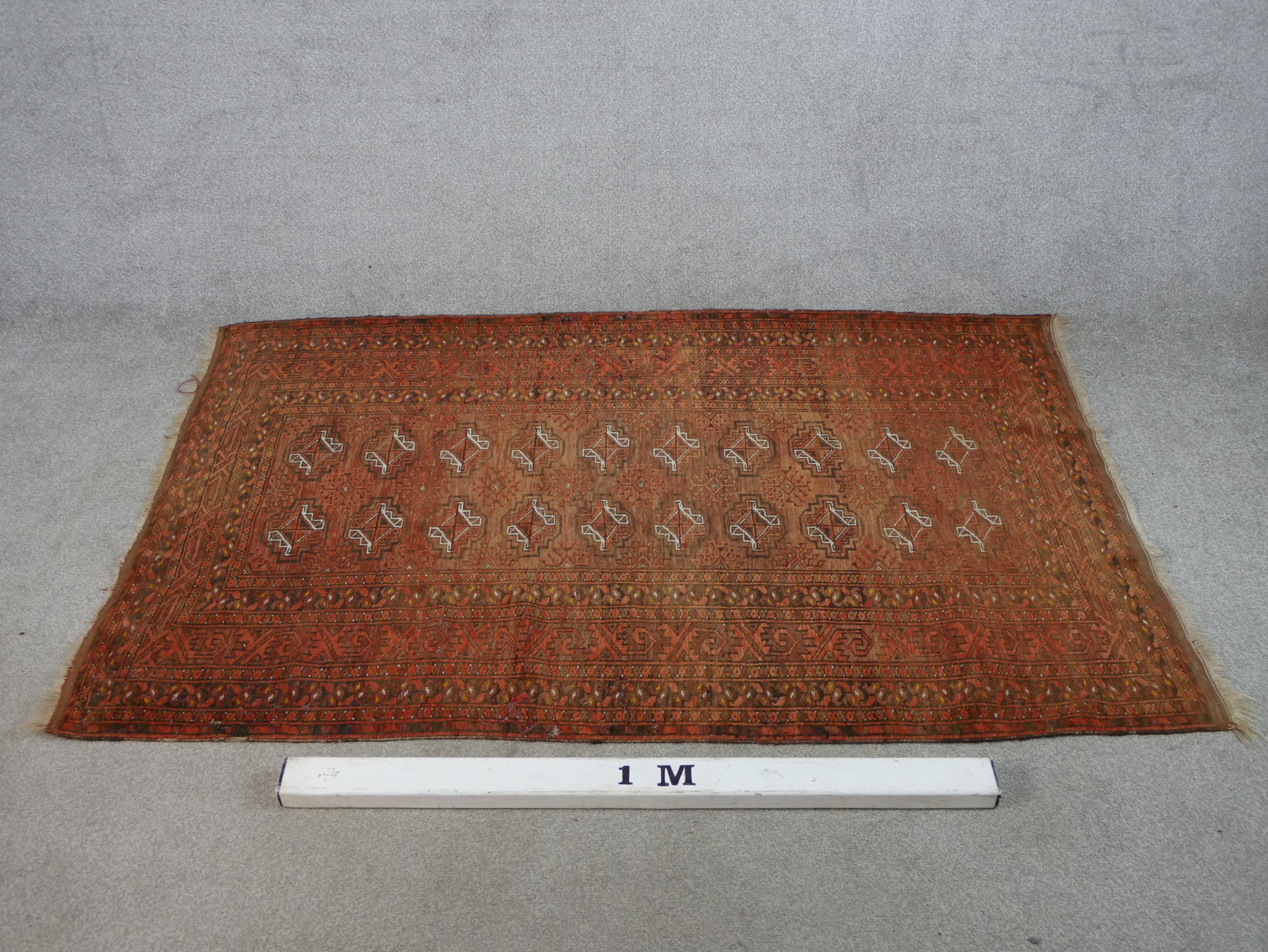 A 20th century Persian orange ground woollen rug with lozenge design within geometric border. H. - Image 2 of 4