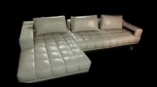 A contemporary quilted white leather L shaped sofa. H.70 W.310 D.164cm.