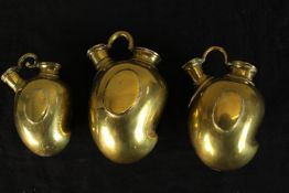 Three 20th century Indian brass mango shaped hookah bases. H.14cm. (largest)