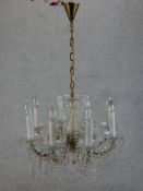 A 20th century eight branch brass and glass electrolier. H.97 W.63 D.63cm