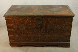 A 19th century Indian mahogany twin brass handled chest with applied studwork decoration raised on