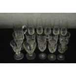 Assorted 19th century and later drinking glasses to include champagne flutes and others. H.7cm (