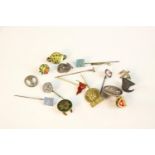 A collection of Danish silver, brass and white metal badges, buttons and pins.