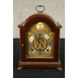 A late 20th century mahogany cased Tempus Fugit dome topped mantle clock, the brass and silvered