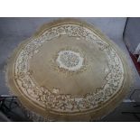 A 20th century Chinese beige ground circular carpet, embroidered with floral decoration. W.270 D.