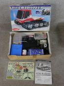 Two boxed scale model vehicles to include Kyosho Nitro Blizzard and Tamiya 1:10 scale model Ford F-