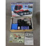 Two boxed scale model vehicles to include Kyosho Nitro Blizzard and Tamiya 1:10 scale model Ford F-